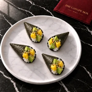 Four portions of Avocado & Mango Cone on a white marble plate