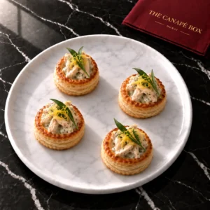 Four portions of Chicken & Tarragon Vol-au-Vent on a white marble plate