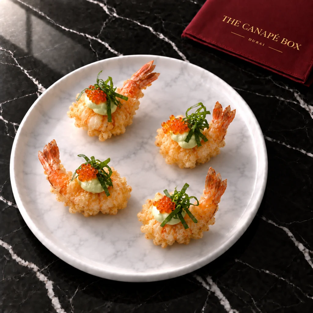 Four portions of Tempura Prawn with Wasabi Mayo on a white marble plate